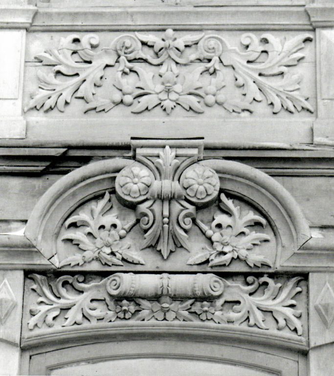 Window ledge on the first floor and gable of a window frame on the ground floor