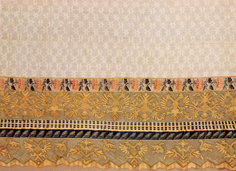 Edge of towel. Thread multicoloured lace