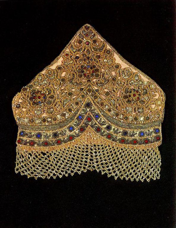 Arkhangelsk headdress of an unmarried peasant girl embroidered with stylized female figures, solar signs and plant motifs