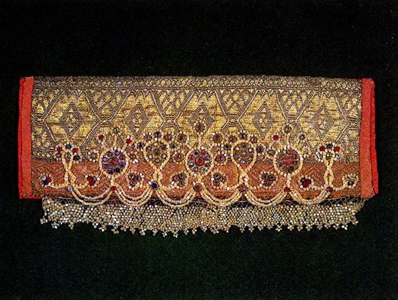 Central Russia headdress with stylized half-figures of women and plant motifs