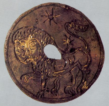Round gilt plaque depicting the figure of a lion. <br/>Late 12th century
