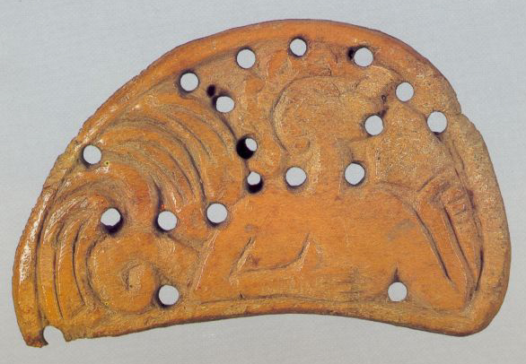 Plaque with a mermaid drinking from a horn. <br/>Second half of the 12th century