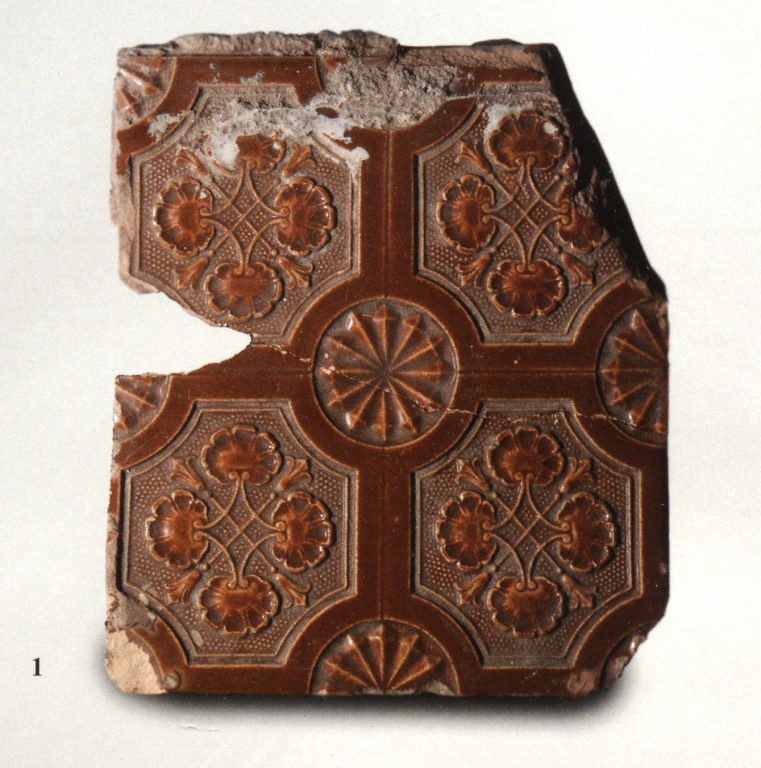 Monochrome wall tiles with floral relief ornament. <br/>Late 19th century - early 20th century
