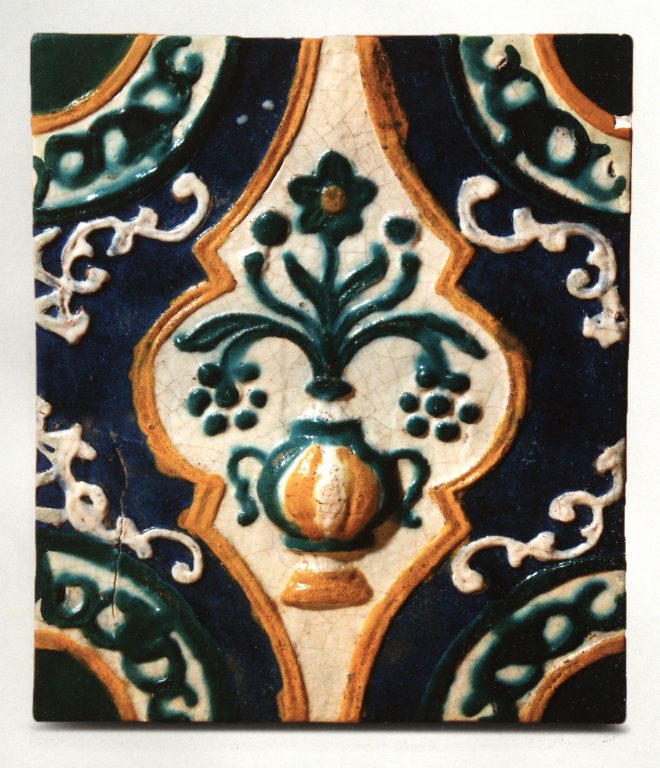 Multicoloured relief wall tile. Plant ornament ("bouquet in a vase" motif). <br/>First half of 18th century