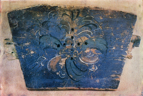 Flower. Painting on a cradle's front panel 