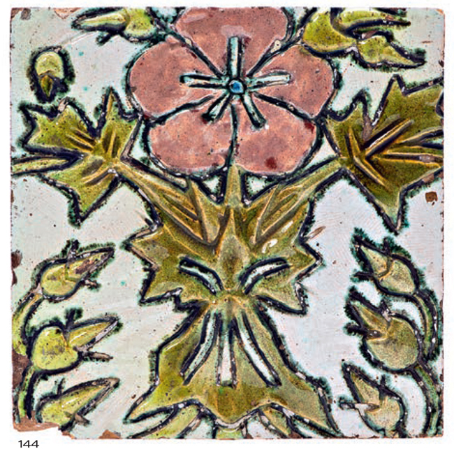 Stove tile with embossed image of a pink flower on a light background