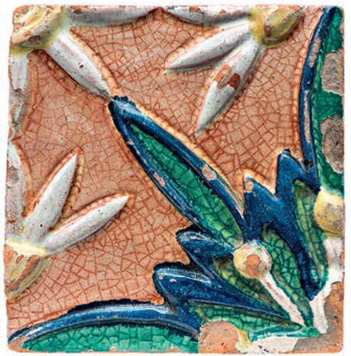 Tile with a relief floral polychrome ornament. Part of the composition