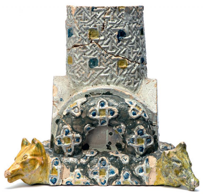 Base and part of a relief polychrome column with sculptured wolf heads