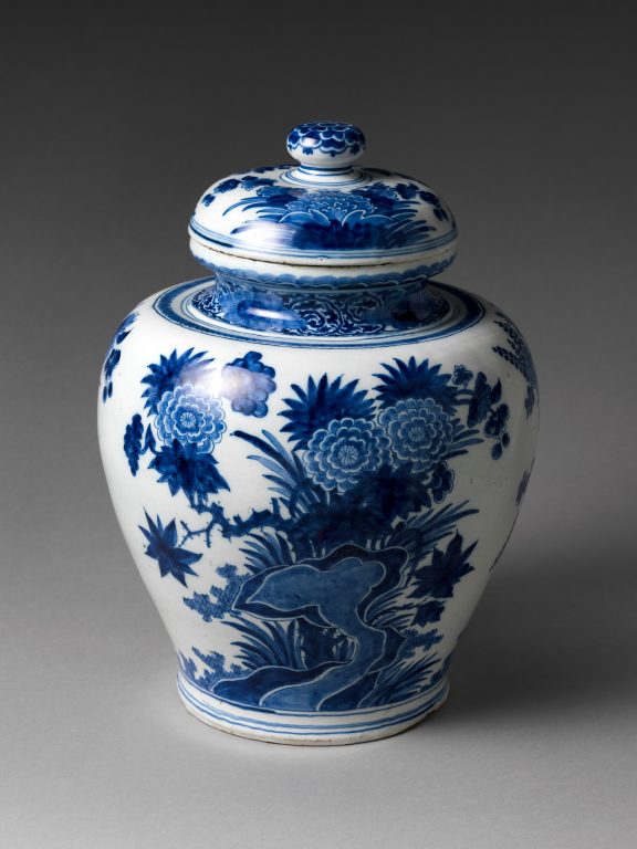 Jar with chrysanthemums and rocks