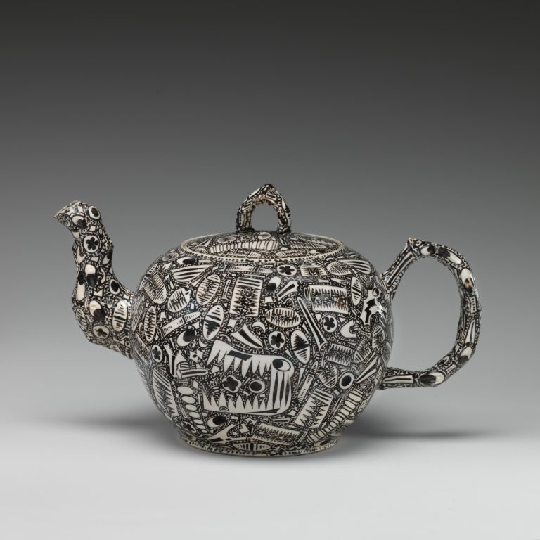 Teapot with fossil decoration