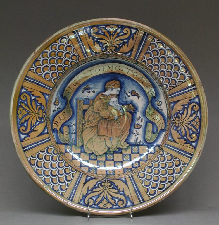 Plate with seated woman reading to a child