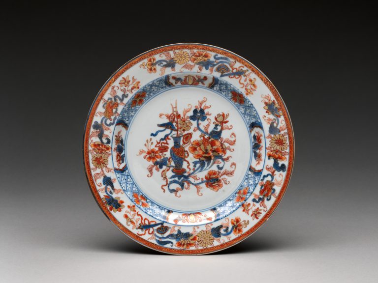 Plate with a vase of flowers