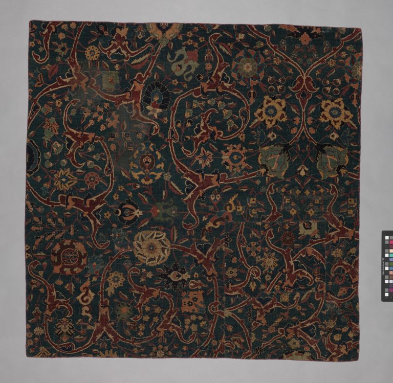 Blue-ground Carpet Fragment with Scrolling Floral Vines. <br/>17th century