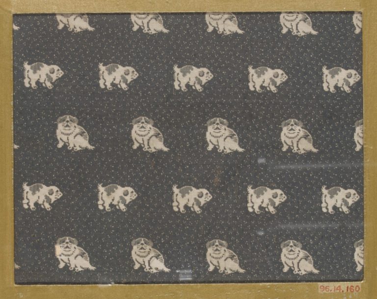 Textile fragment with repeating pattern of dogs on dotted ground