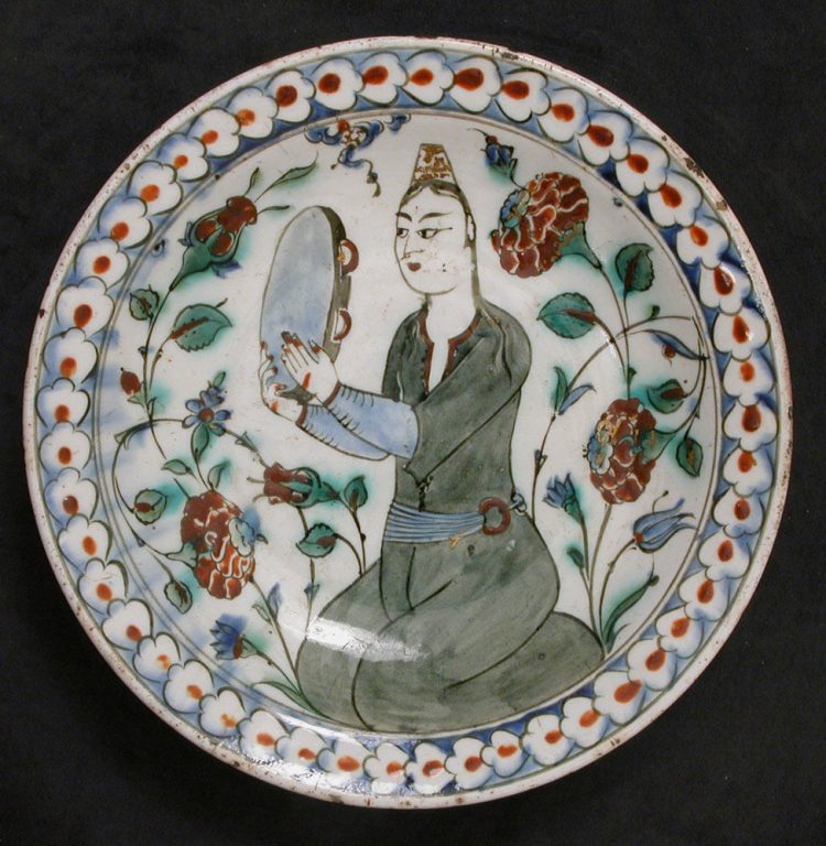 Plate Depicting a Woman Playing Tambourine